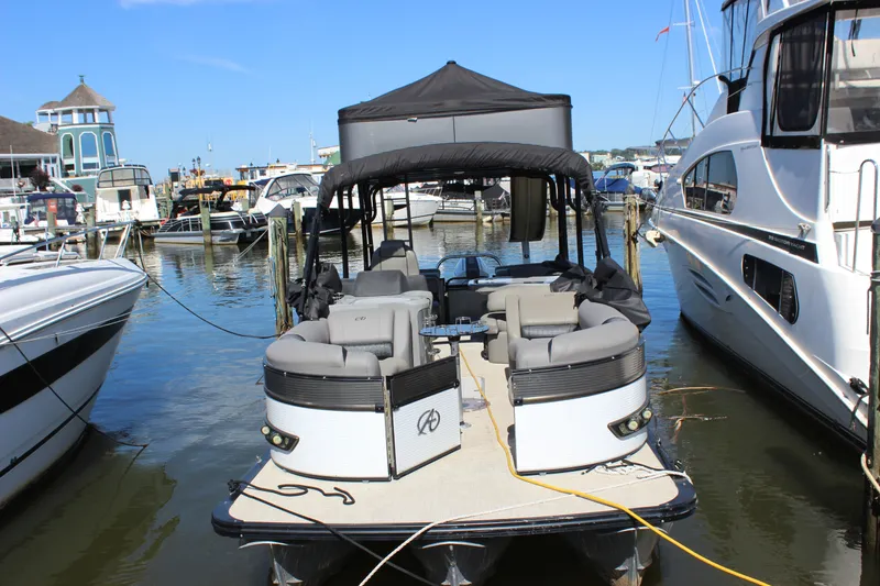 Slide: The Image of 2020 Avalon Catalina Platinum Cruise Funship, 27-foot pontoon boat docked at marina. - 24