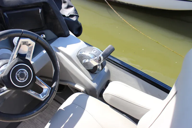 Slide: The Image of Steering wheel and controls of 2020 Avalon Catalina Platinum Cruise Funship boat. - 17