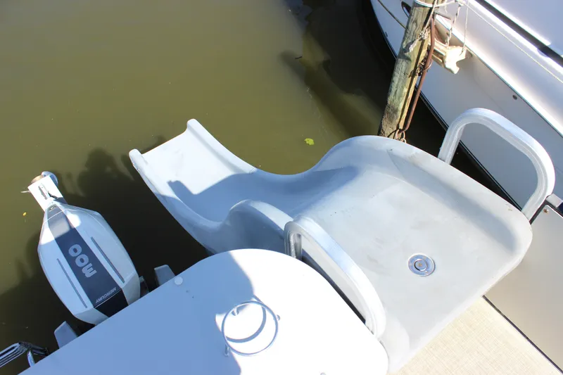 Slide: The Image of 2020 Avalon Catalina Platinum Cruise Funship with slide and motor, docked on calm water. - 30