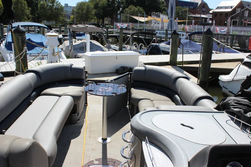 Slide: The Image of Luxurious 2020 Avalon Catalina Platinum Cruise Funship at marina, featuring spacious seating and modern amenities. - 18