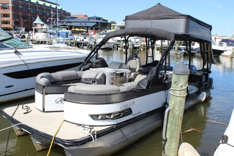 Slide: The Image of 2020 Avalon Catalina Platinum Cruise Funship pontoon boat docked at a marina. - 25