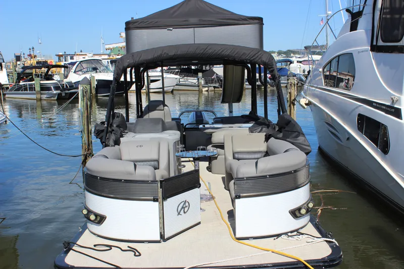 Slide: The Image of 2020 Avalon Catalina Platinum Cruise Funship, 27-foot pontoon boat docked at marina. - 23