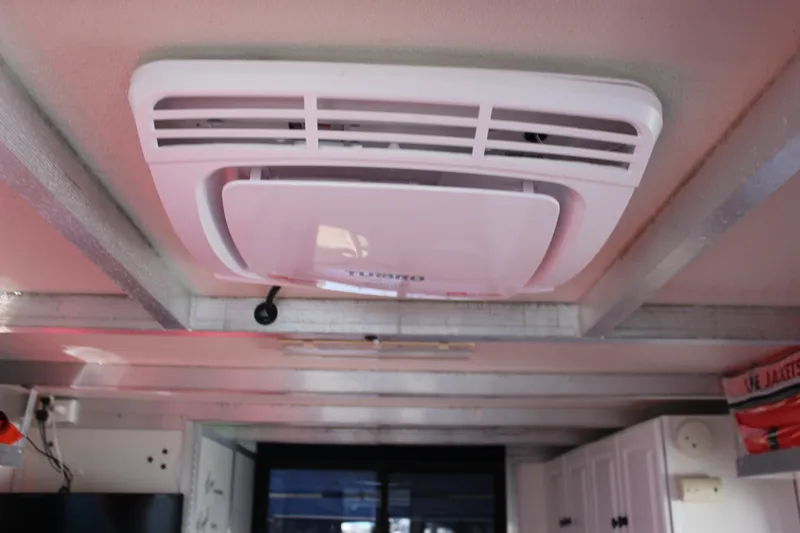 Slide: The Image of Ceiling air conditioning unit inside 1994 Sun Tracker Party Cruiser 32 Regency Edition. - 16