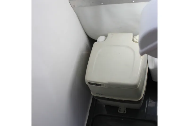 Slide: The Image of Portable toilet inside 1994 Sun Tracker Party Cruiser 32 Regency Edition boat. - 18