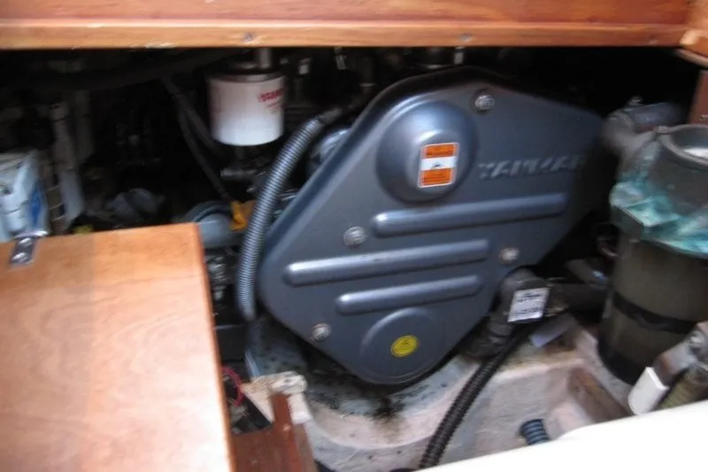 Slide: The Image of Engine compartment of a 2002 Nauticat 37 sailboat, featuring a Yanmar engine. - 22
