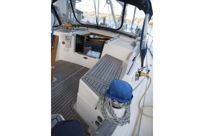 Slide: The Image of 2002 Nauticat 37 sailboat cockpit with teak flooring and nautical equipment. - 29