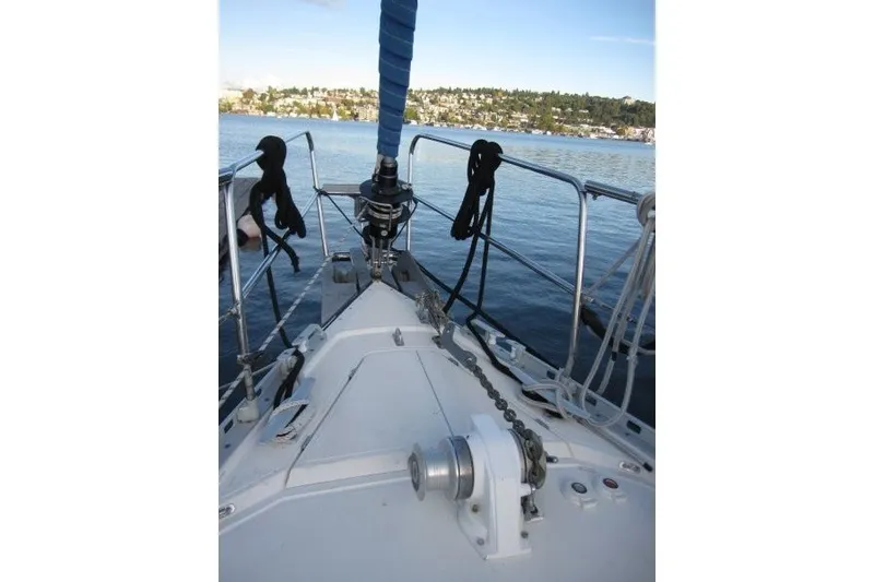 Slide: The Image of Bow view of 2002 Nauticat 37 sailboat on calm water. - 32