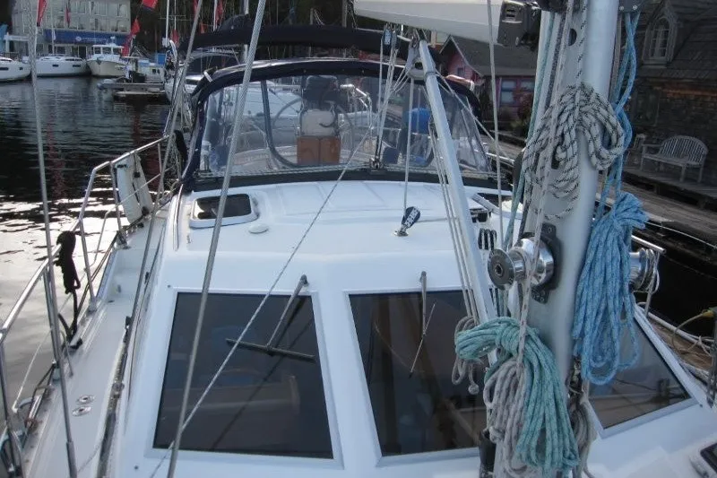 Slide: The Image of 2002 Nauticat 37 sailboat docked, showcasing deck and rigging details. - 35