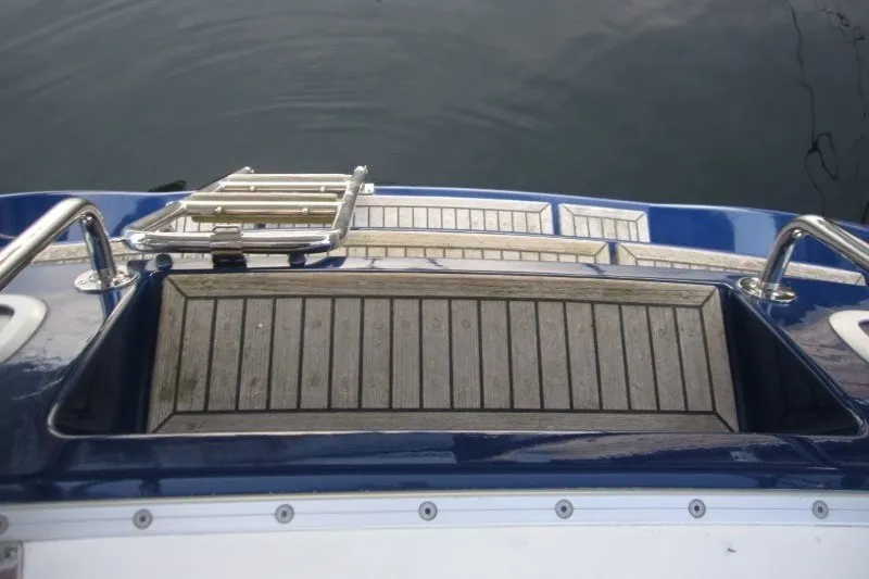 Slide: The Image of Stern view of 2002 Nauticat 37 yacht with swim platform and ladder. - 28