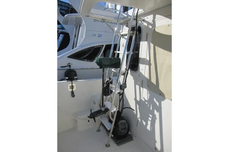 Slide: The Image of American Tug 34, 2002 model, featuring a ladder and deck equipment. - 28