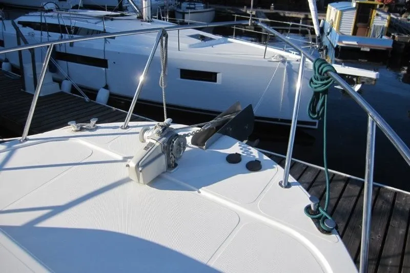 Slide: The Image of Bow of a 2002 American Tug 34 with anchor and winch system. - 34