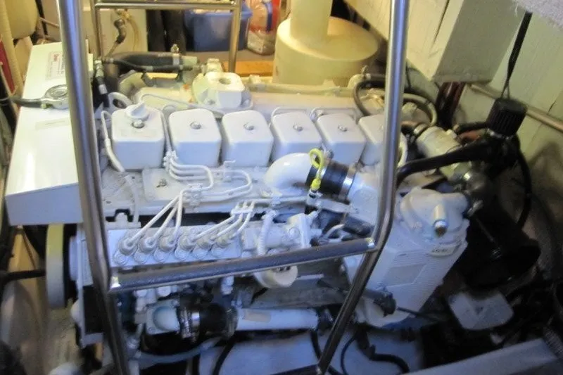 Slide: The Image of Engine room of a 2002 American Tug 34, showcasing detailed mechanical components. - 20