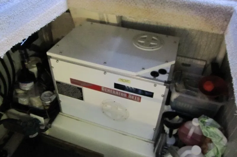 Slide: The Image of Engine room of a 2002 American Tug 34 featuring a generator set. - 21