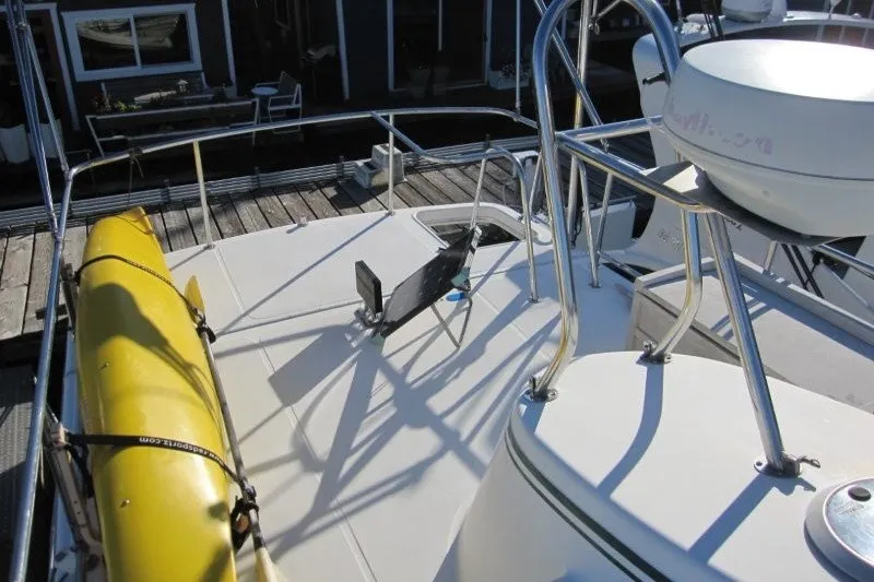 Slide: The Image of Deck view of 2002 American Tug 34 with yellow kayak and railing. - 32