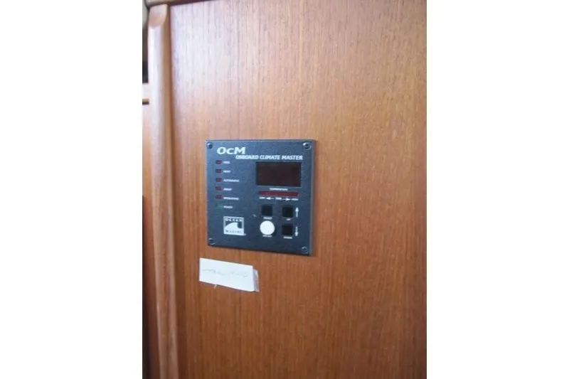 Slide: The Image of Onboard climate control panel in 2002 American Tug 34 boat interior. - 19