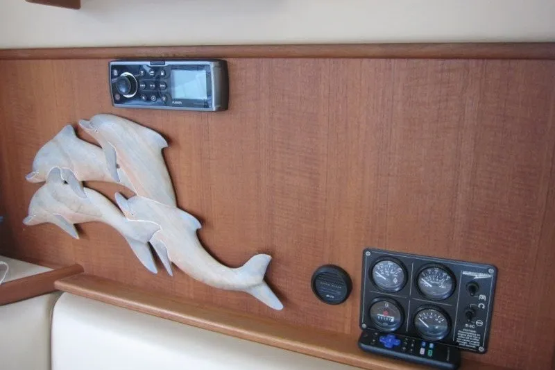 Slide: The Image of Interior of 2002 American Tug 34 with dolphin decor and control panel. - 18