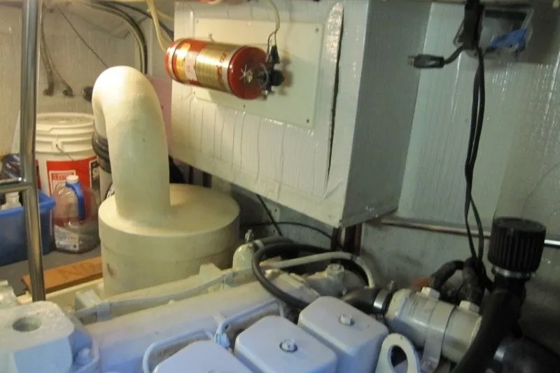 Slide: The Image of Engine room of a 2002 American Tug 34 with fire extinguisher and ventilation system. - 23