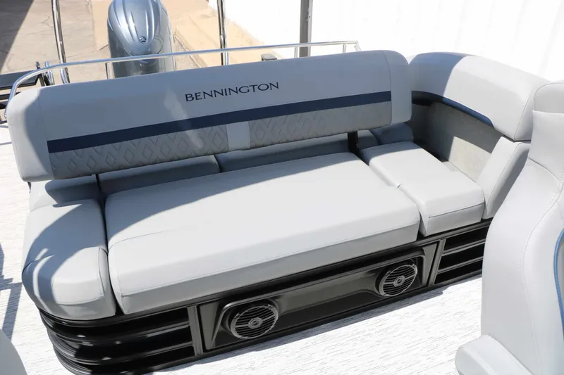 Slide: The Image of The image shows a luxurious seating area on a Bennington 22 MSB Tri Toon boat. - 49
