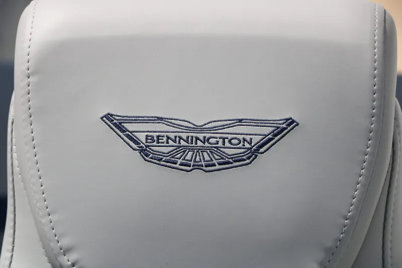 Slide: The Image of Close-up of a seat with the embroidered Bennington logo on gray upholstery. - 41