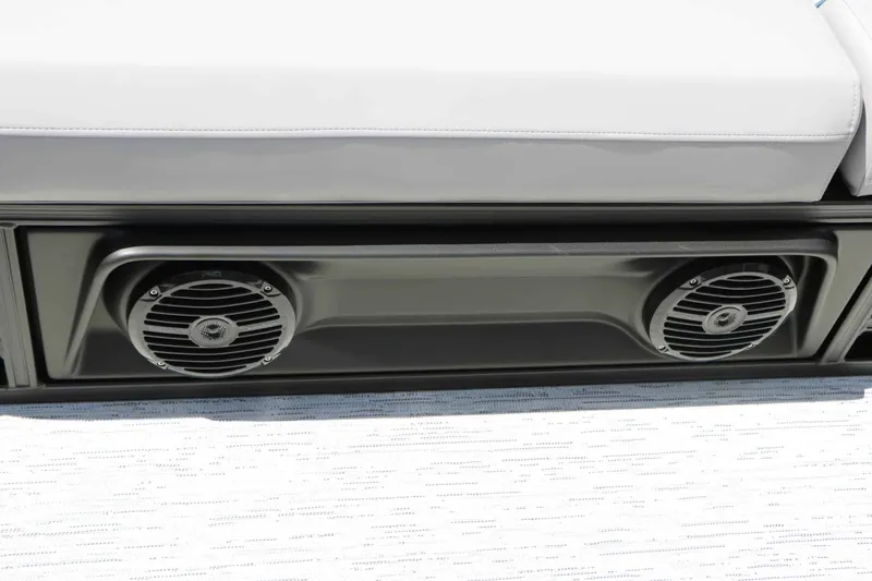Slide: The Image of Close-up of speakers on a modern boat, built into a black console beneath a white seat. - 50