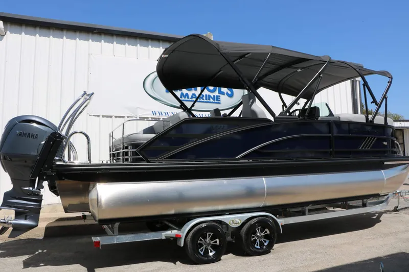 Slide: The Image of Bennington 22 MSB Tri Toon 2027 with Yamaha outboard motor on a trailer. - 15