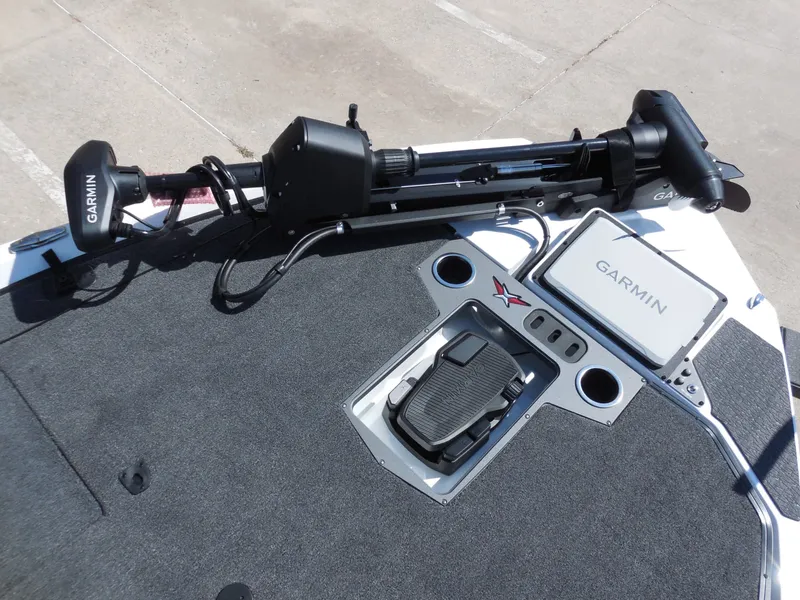 Slide: The Image of The image shows the deck of a Vexus VXs21 boat with Garmin equipment and pedal controls. - 17