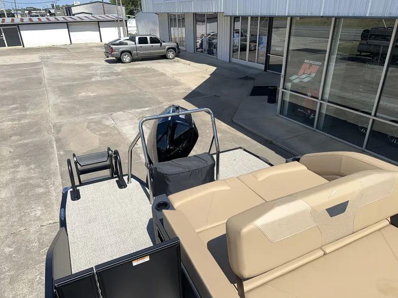 Slide: The Image of The image shows an Evotti 525 CS boat from 2027 on a parking lot. It features beige seats and an outboard motor. - 11