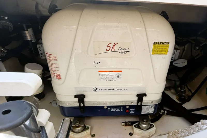 Slide: The Image of Fischer Panda 5K generator in a 2023 Pusuit d 326 boat engine compartment. - 18