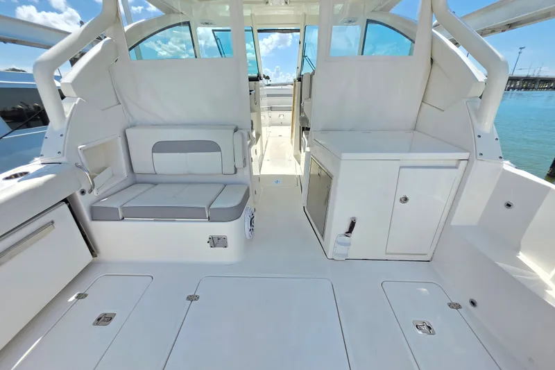 Slide: The Image of Spacious interior of 2023 Pursuit D 326 boat with seating and storage. - 5