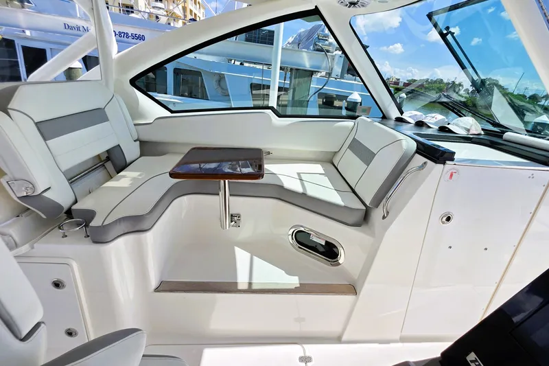 Slide: The Image of Luxurious interior of 2023 Pusuit d 326 boat with sleek seating and table. - 8