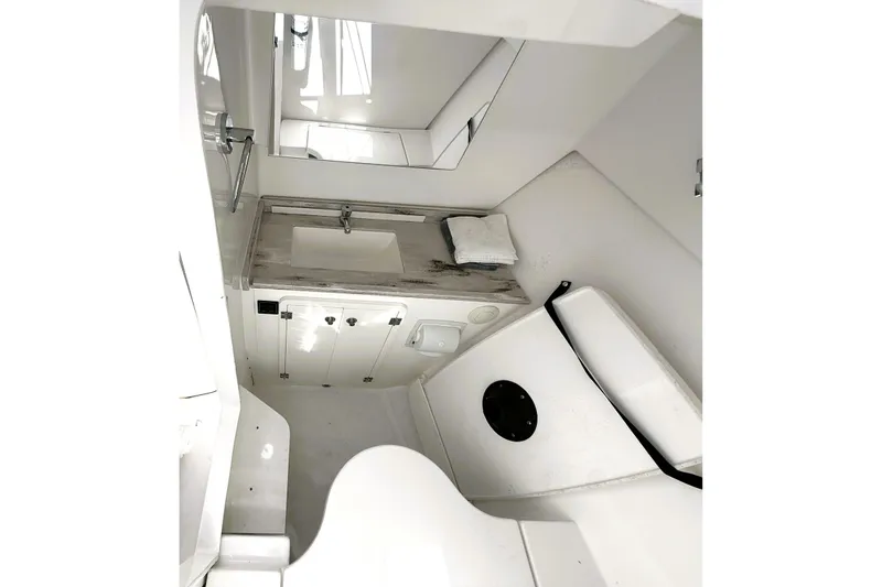 Slide: The Image of Compact white bathroom interior in 2023 Pusuit d 326 model boat. - 13