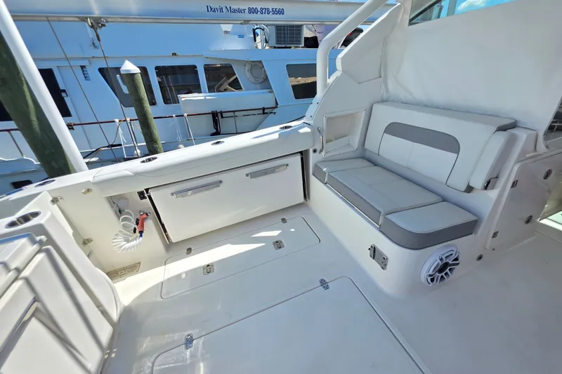 Slide: The Image of Luxurious seating area on 2023 Pusuit d 326 boat, featuring sleek design and ample storage. - 7