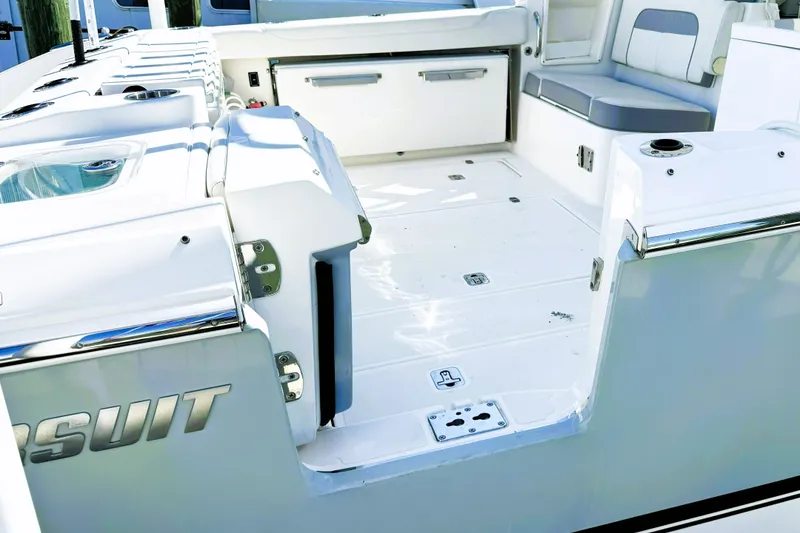 Slide: The Image of 2023 Pursuit D 326 boat interior with seating and storage compartments. - 4