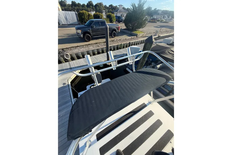 Slide: The Image of 2015 C-Hawk 25 Center Console boat docked, featuring sleek design and sturdy construction. - 10