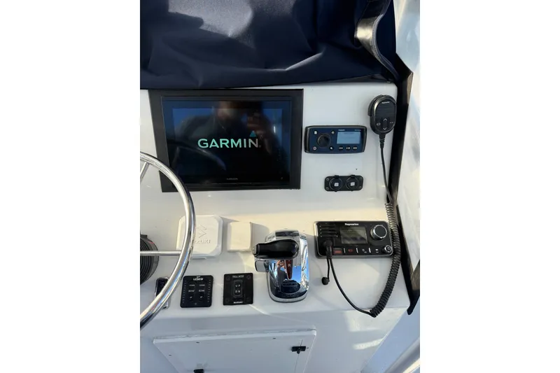 Slide: The Image of 2015 C-Hawk 25 Center Console dashboard with Garmin navigation and communication equipment. - 6
