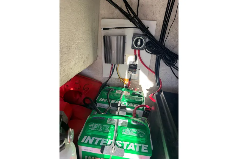 Slide: The Image of Battery compartment of 2015 C-Hawk 25 Center Console with Interstate batteries and wiring. - 19