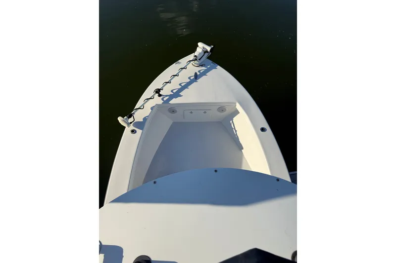 Slide: The Image of 2015 C-Hawk 25 Center Console boat bow with anchor, on calm water. - 12