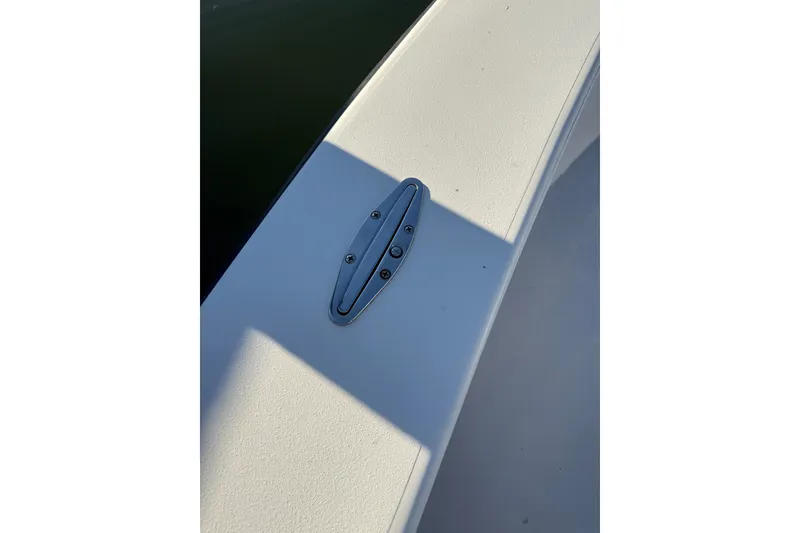 Slide: The Image of 2015 C-Hawk 25 Center Console boat deck with cleat in sunlight. - 21