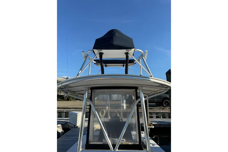 Slide: The Image of 2015 C-Hawk 25 Center Console boat with tower against clear blue sky. - 14