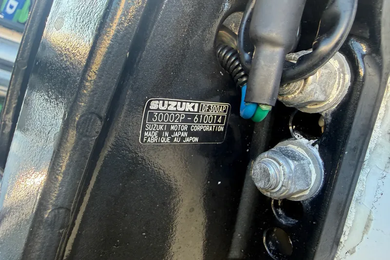 Slide: The Image of Suzuki motor label on a 2015 C-Hawk 25 Center Console boat engine. - 23