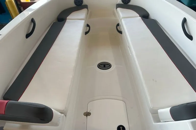 Slide: The Image of Interior view of 2027 Tahoe T18 boat with cushioned seating and storage compartments. - 10