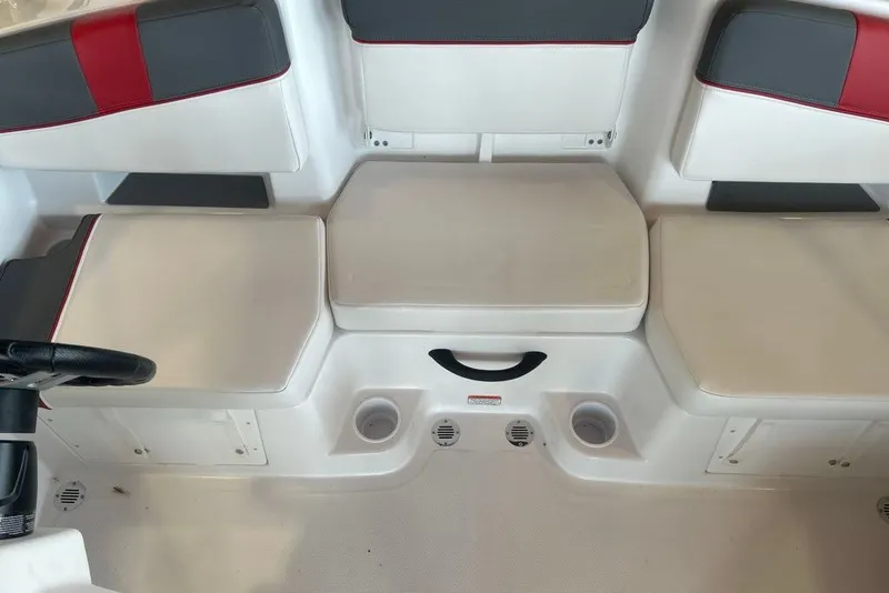 Slide: The Image of Interior seating of a 2027 Tahoe T18 boat with white and gray upholstery. - 6