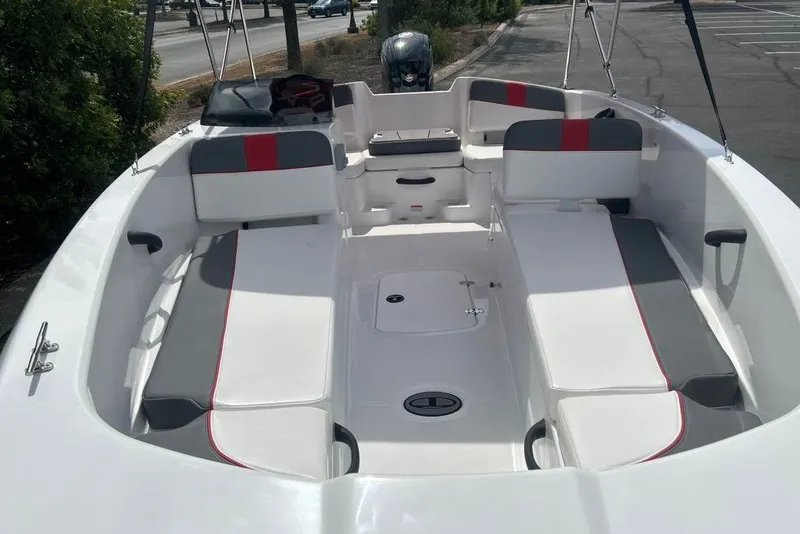 Slide: The Image of 2027 Tahoe T18 boat interior with white and gray seating, red accents, and spacious layout. - 5