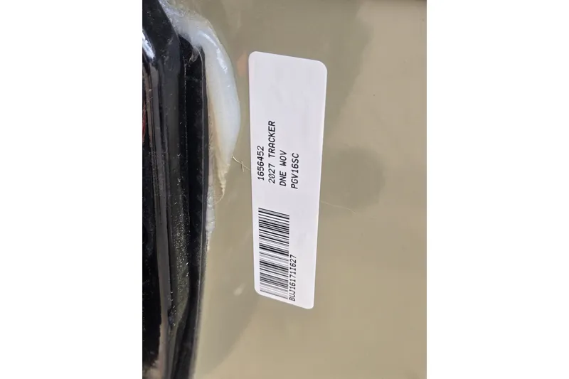 Slide: The Image of Label on 2027 Tracker Pro Guide V-16 SC boat, featuring model details and barcode. - 17