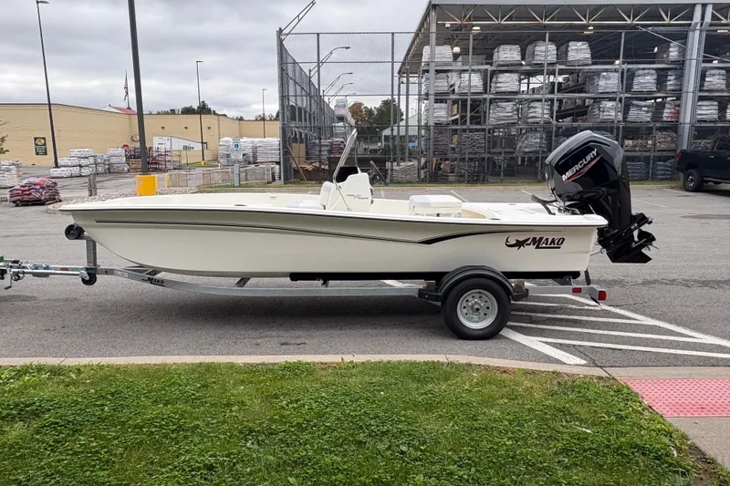 The Image of 2027 Mako Pro Skiff 17 CC boat on trailer in parking lot. - 0