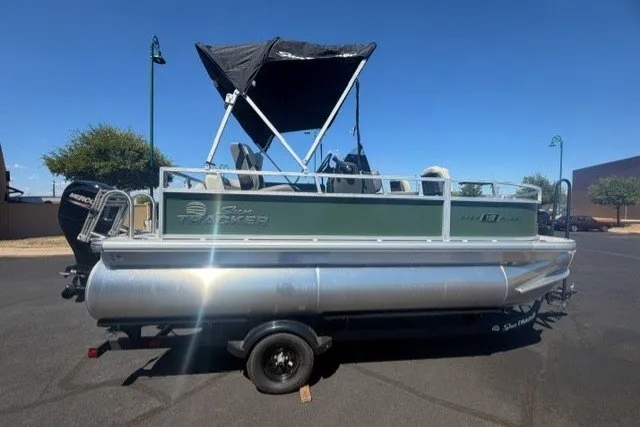 The Image of 2027 Sun Tracker Bass Buggy 16 XL Select pontoon boat with canopy on trailer. - 0