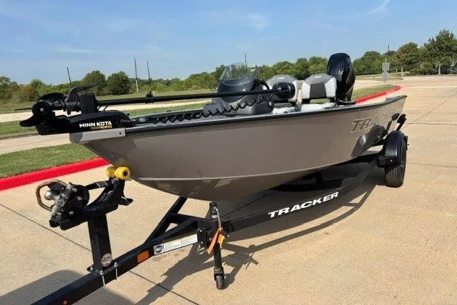 The Image of 2027 Tracker Super Guide V-16 SC boat on trailer, featuring Minn Kota trolling motor. - 0