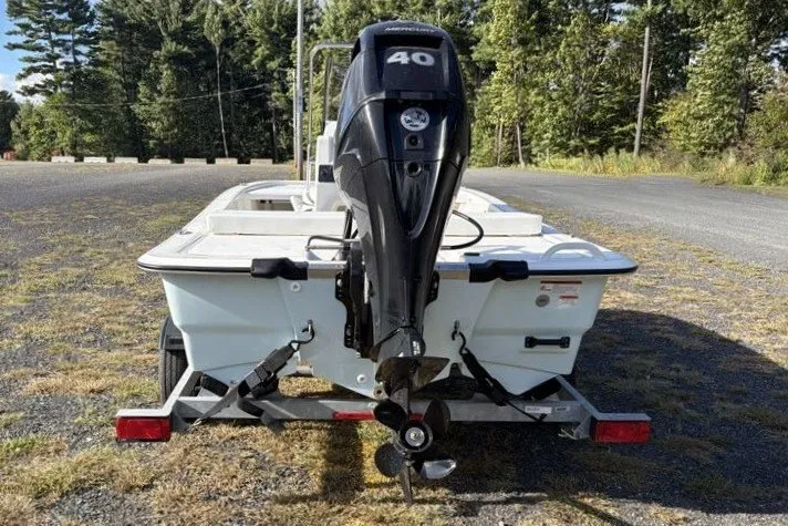 Slide: The Image of 2026 Mako Pro Skiff 13 CC with 40 HP outboard motor on trailer. - 9