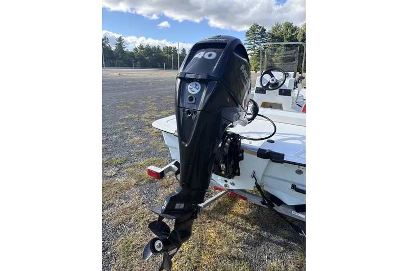 Slide: The Image of 2026 Mako Pro Skiff 13 CC with Mercury 40 outboard motor in outdoor setting. - 10