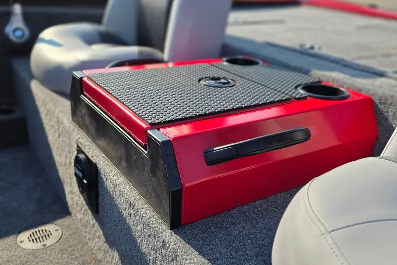 Slide: The Image of Red and black console in 2027 Tracker Savage 215 boat interior. - 24